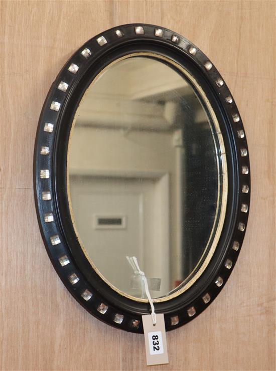 A small Irish style oval wall mirror H.45cm